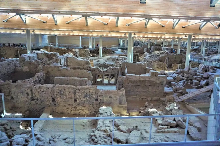 Excavated Bronze Age houses under the roof of ancient Akrotiri, Santorini